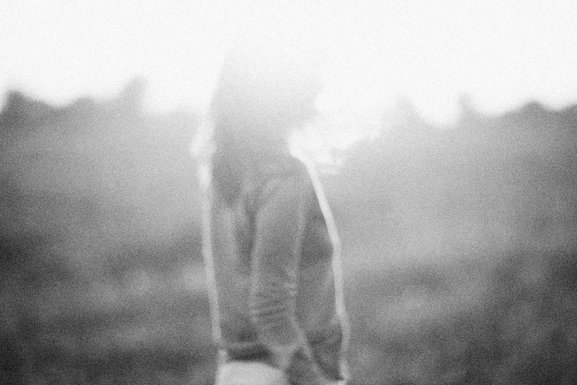 a grayscale image of a woman