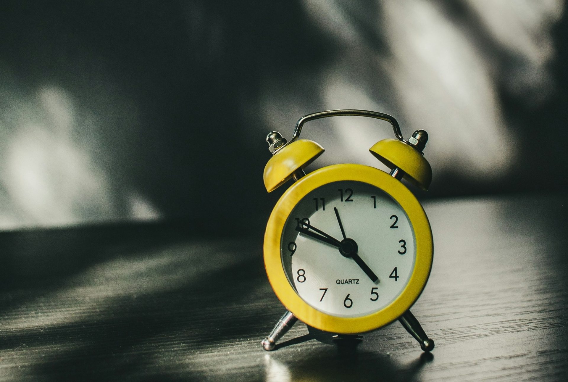 a yellow small quartz vintage clock